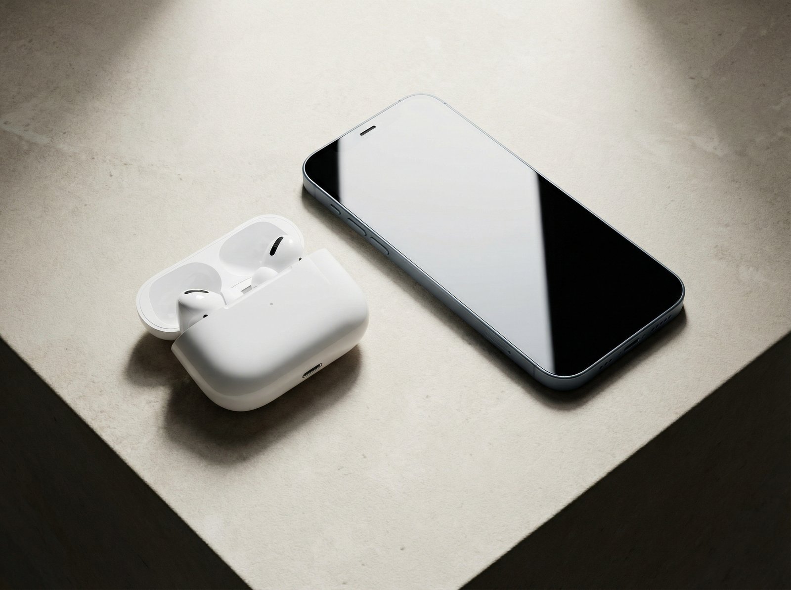 AirPods Pro 3 and a very thin iPhone Air laid out on a clean, light-colored surface, showcasing their sleek design, high contrast, no visible text, aspect ratio 4:3
