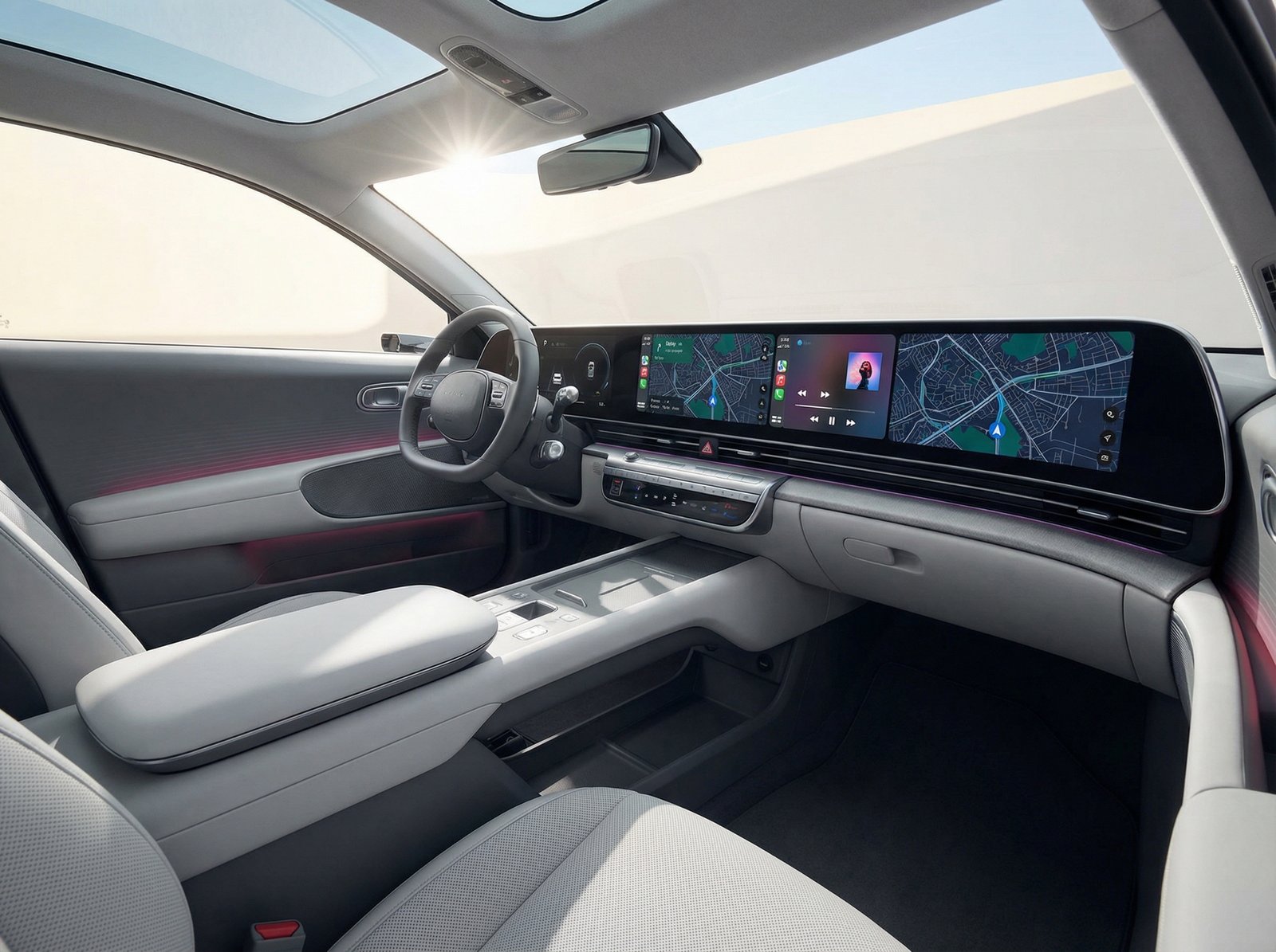 The interior of a modern Hyundai IONIQ 3 electric vehicle, featuring a sleek dashboard and a large, integrated display running Apple CarPlay Ultra, showing navigation and media. Aspect ratio 4:3. No visible text.