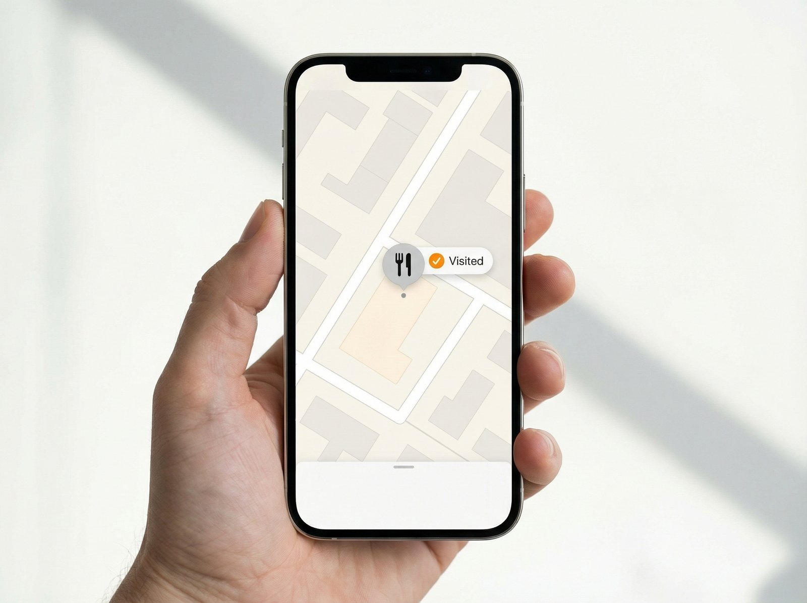 An iPhone displaying Apple Maps with a Visited tag on a restaurant search result. Clean layout, modern design, bright lighting. 4:3 aspect ratio, no visible text.