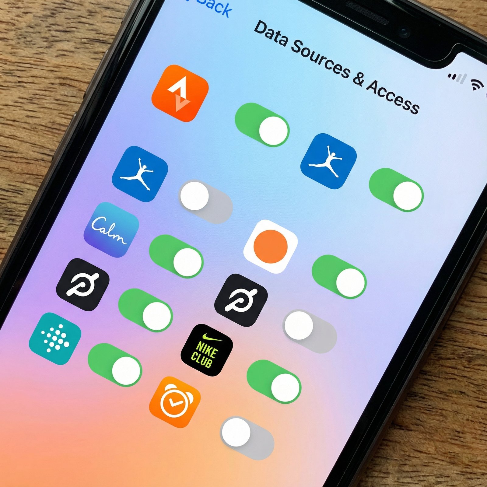 A detailed composition of an iPhone screen showing the "Data Sources & Access" section within the Apple Health app, with various app icons and toggle switches. Modern layout, colored background, no visible text, 1:1 aspect ratio.